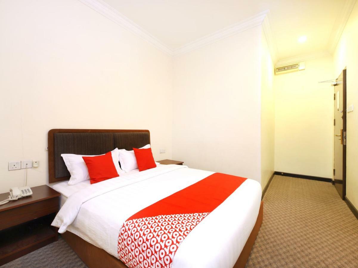 Oyo 750 Comfort Hotel Кота-Кинабалу Экстерьер фото